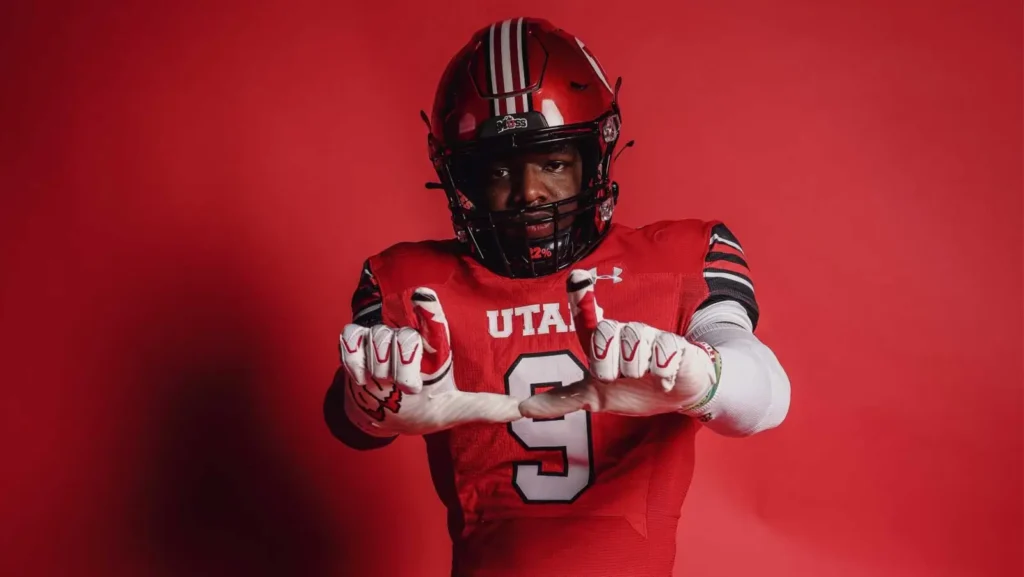 a man wearing a football uniform and gloves